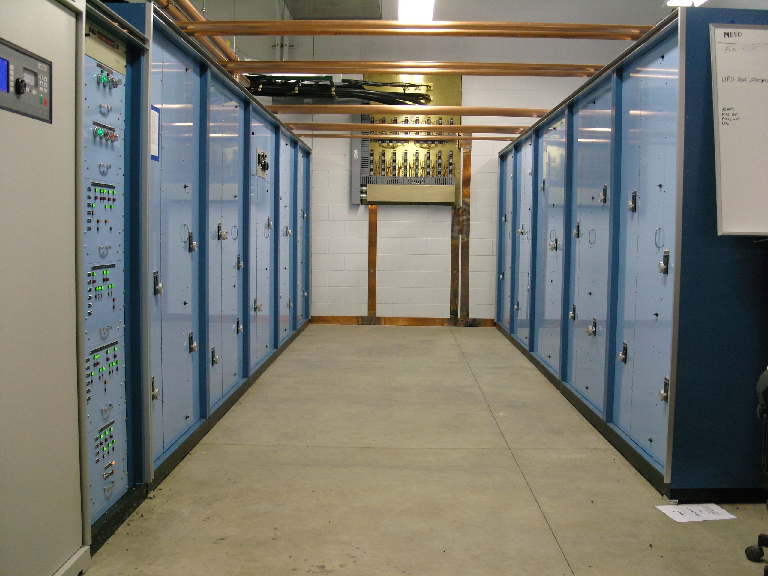 Phasor shown in transmitter room with bulkhead grounding panel shown on wall